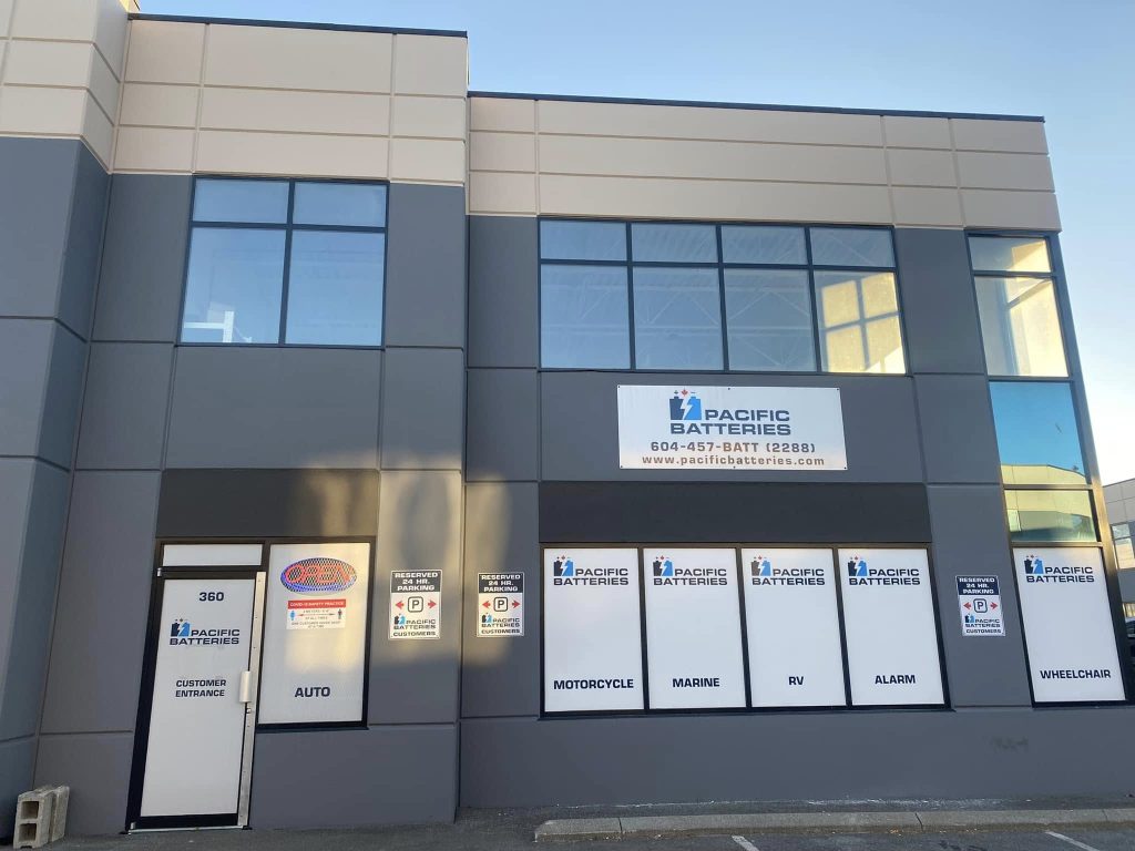 pacific batteries storefront signs and entrance with window